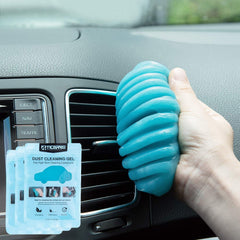 Car cleaning gel putty being pressed into air vent to remove dust and debris from car interior