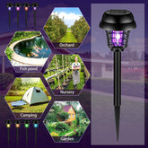 12-pack solar powered bug zapper with purple UV light glowing in garden at night for mosquito control