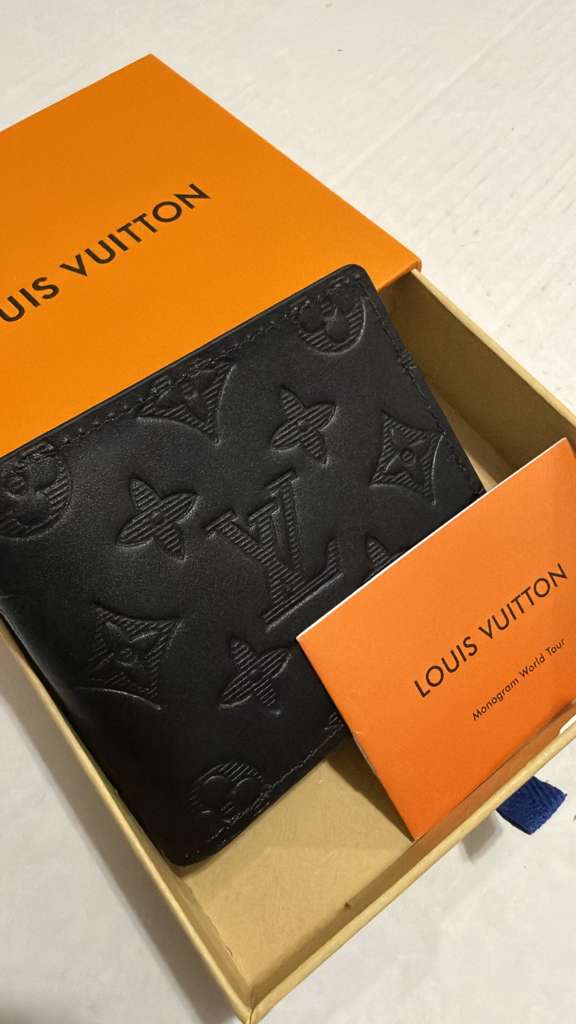 Authentic Louis Vuitton Multiple Wallet in black Monogram Shadow embossed leather with original box