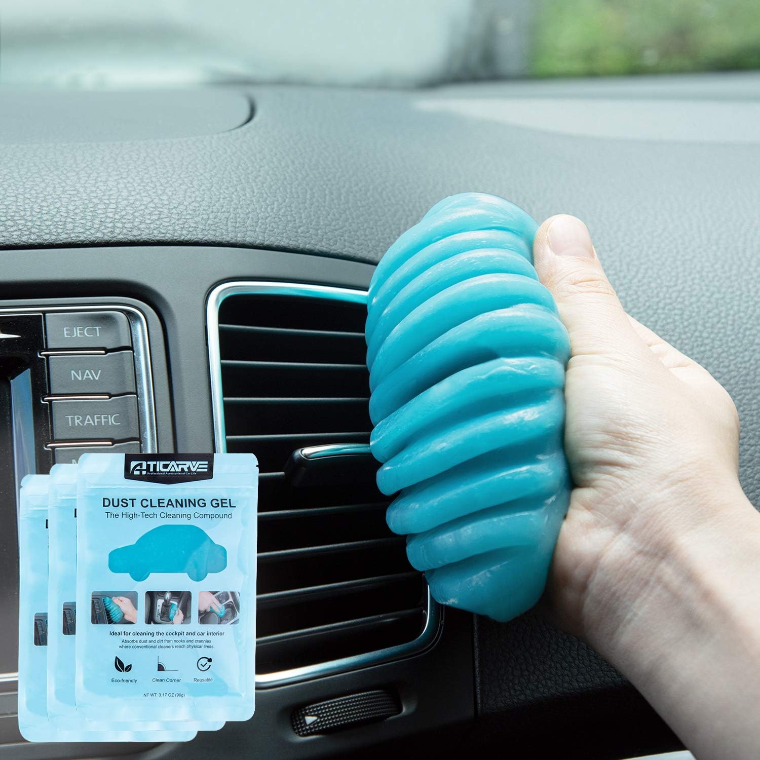Car cleaning gel putty being pressed into air vent to remove dust and debris from car interior