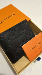 Authentic Louis Vuitton Multiple Wallet in black Monogram Shadow embossed leather with original box