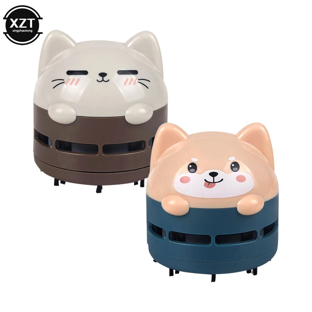 Cute mini USB rechargeable desk vacuum cleaner cleaning a computer keyboard